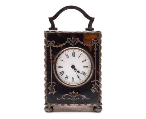 An Edwardian miniature tortoiseshell and silver carriage clock: the eight-day duration timepiece movement having a platform l
