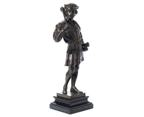 A bronze study of a medieval guard: dark brown patination, the bearded figure holding a mace over his right shoulder and gras