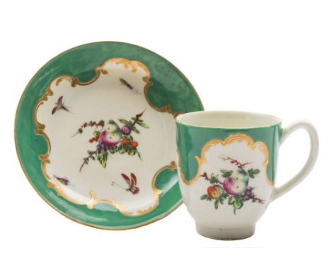 A First Period Worcester coffee cup and saucer: painted with 'spotted fruit' and insects within gilt scrollwork and apple gre