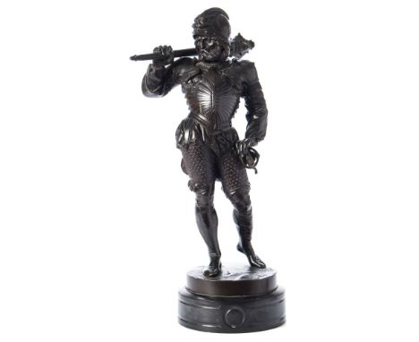 A bronze study of a Renaissance Knight: dark brown patination, the bearded warrior wearing armour and holding a battle mace o