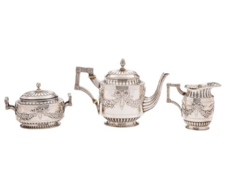 A Continental silver three piece tea service, bears Dutch import marks: of oval outline with embossed ribbon tied garland dec