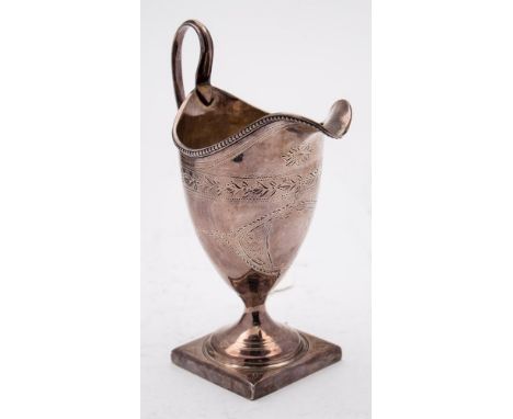 A George III silver cream jug, maker George Gray, London, 1791: of helmet-shaped outline with bright-cut decoration, raised o