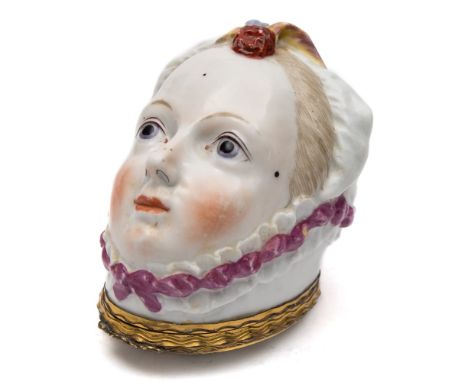 A Chelsea bonbonniere: modelled as a lady's head wearing a pink ribbon trimmed mob-cap with feather plume, the interior paint
