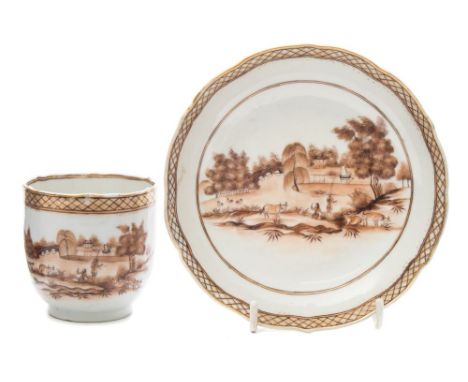 A Chinese export cup and saucer: painted in sepia monochrome with a European river landscape with a fisherman and water buffa