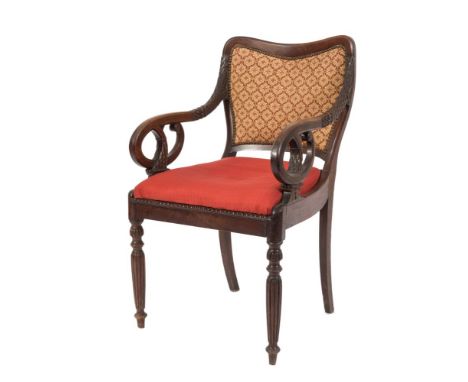 An early Victorian Colonial carved hardwood open armchair:, with an upholstered panel cartouche shaped back, having foliate d