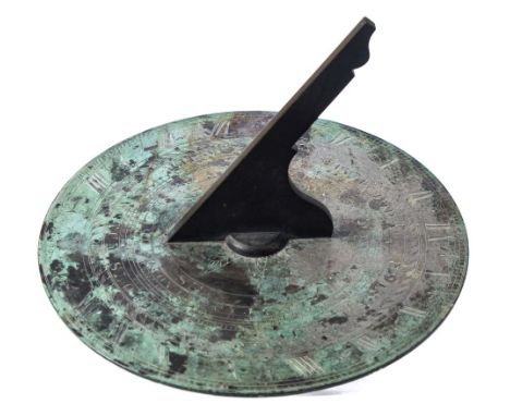 J Barker & Son, London. a bronze 12ins sundial: with shaped gnomon, with incised compass, scales for months and days, watch s