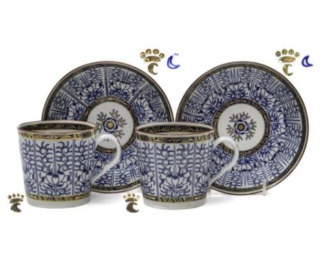 A pair of Worcester porcelain coffee cans and deep saucers: painted in blue in the 'Royal Lily' pattern within gold borders a