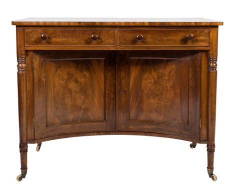 A George IV mahogany dressing table :, the top with a crossbanded and line inlaid border, fitted with two frieze drawers, the