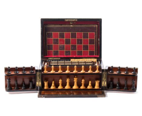 A 19th century rosewood games compendium: the rectangular box with lift-up lid and hinged front, enclosing a set of boxwood a