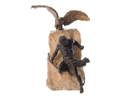 A 19th century gilt metal and bronze study 'The Torture of Prometheus': the semi naked figure chained by the wrists and ankle