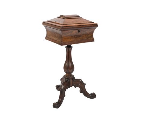 A Victorian rosewood sarcophagus shaped pedestal work table:, the hinged top enclosing a lined interior, on fluted and reeded