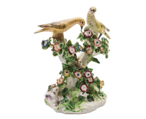 A Bow 'Birds In Branches' candlestick group: modelled as two birds perched on flowering branches, a nest below with three chi