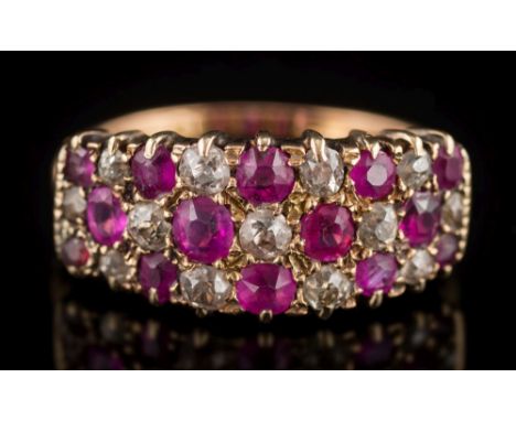 A ruby and diamond cluster ring: with graduated oval and round rubies between round old-cut diamonds, 3.5gms gross weight, ri