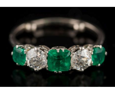 An emerald and diamond five-stone ring: with three 'emerald-cut' emeralds approximately 4.2mm, 5.5mm and 4.2mm long, separate