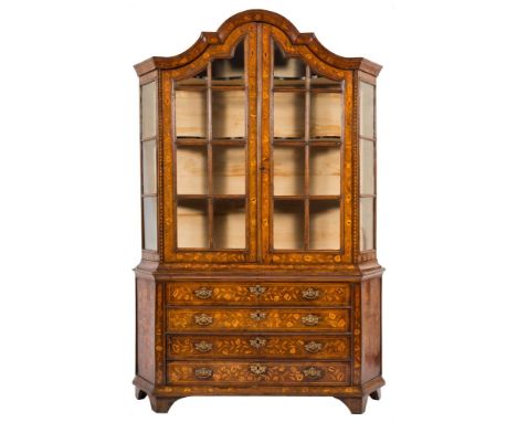 A late 18th/early 19th Century Dutch walnut and floral marquetry domed display cabinet:, of canted outline, decorated with tr