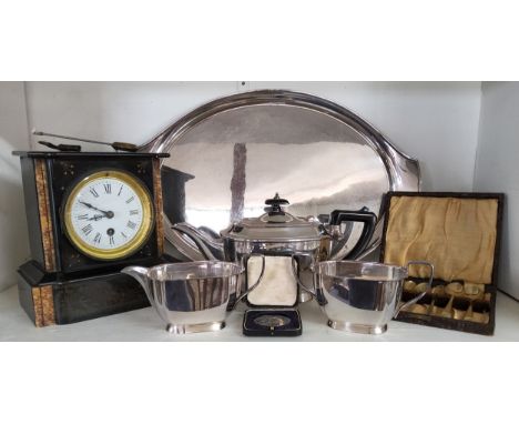 A 19th century Belge Noir mantel clock, Elkington four piece tea service; a white medal by Vaughtons Birmingham for the North