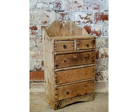 A rustic 19th century farmhouse pine spice rack of two above three drawers c.1880 