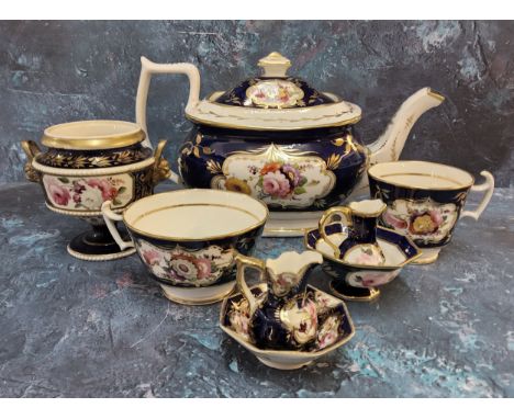 A mid 19th century boat shaped teapot and cover, possibly Coalport, decorated with colourful summer flowers on a cobalt blue 