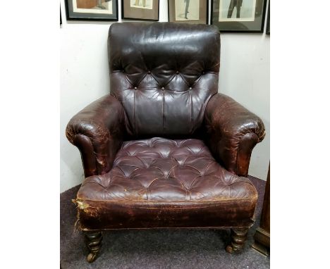 A Victorian leather arm chair, button back and seat, scroll arms, turned mahongay legs, c.1860 