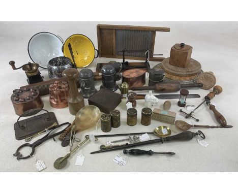 A large collection of kitchenalia, including copper jelly moulds, treen, a rolling pin, horn spoons, a champagne tap, pepper 
