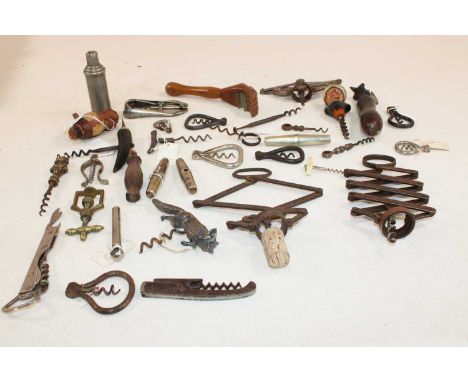 A group of vintage corkscrews, including ratchet examples, one set with a fox, one set with an ice pick.