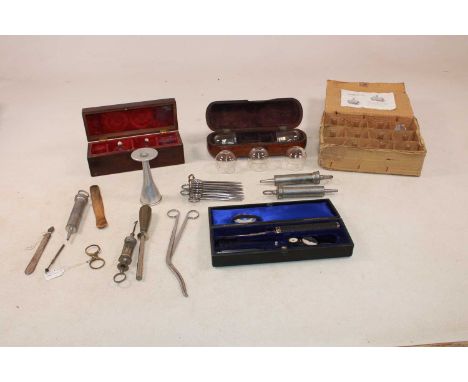 A small group of scientific instruments and related items, including a box of eleven 'Ventouses Epy', a mahogany box containi
