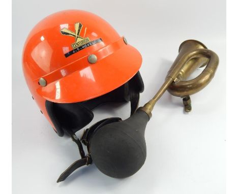 A Centurion crash helmet, with visor and a brass motor horn, (2)