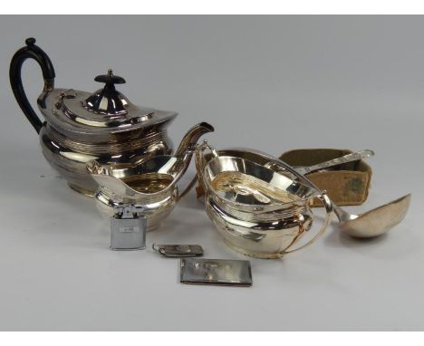 A three piece silver plated tea set, silver plated soup ladle and other flatware, etc