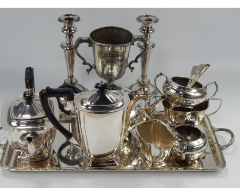 A silver plated tea service, comprising teapot, coffee pot, hot water pot, sugar bowl, milk jug, tray, etc and a pair of silv