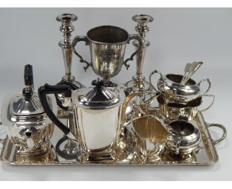 A silver plated tea service, comprising teapot, coffee pot, hot water pot, sugar bowl, milk jug, tray, etc and a pair of silv