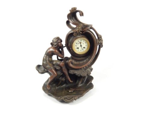 An early 20thC Continental spelter figural mantel clock, depicting lady with cresting wave, the dial having floriate painted 