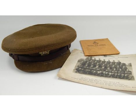 An army officers cap by Dunn & Co, with East Africa regimental badge and a Royal Airforce Service and release book and photog