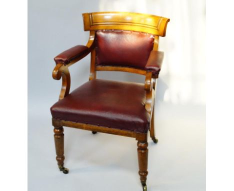 A Victorian light oak open armchair, with padded back and arms and over upholstered seat in red rexine, on turned supports an