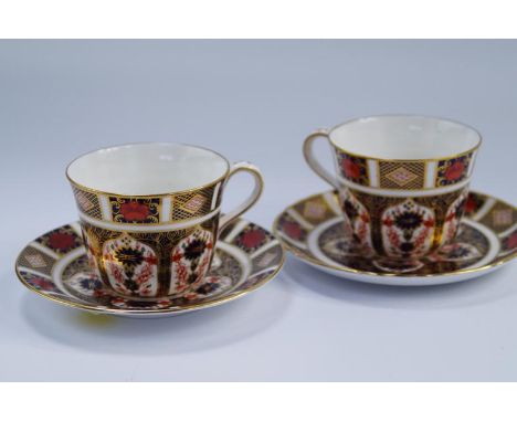 Two Royal Crown Derby Old Imari 1128 pattern cabinet cups and saucers