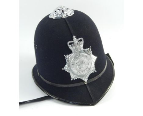 A Police helmet, with badge for Metropolitan Police