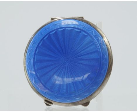 A George VI silver and enamelled circular powder compact, with engine turned decoration and blue guilloche enamel to the back