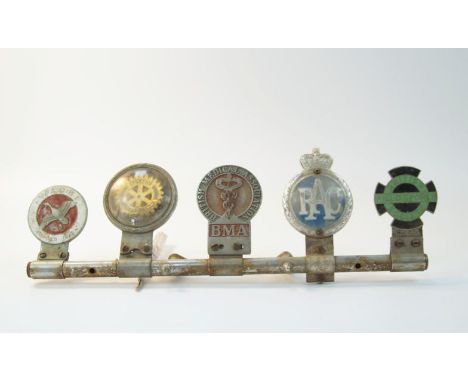 A mascot badge bar, comprising W A GBI founded in 1908, Rotary International, British Medical Association, Royal Automobile C