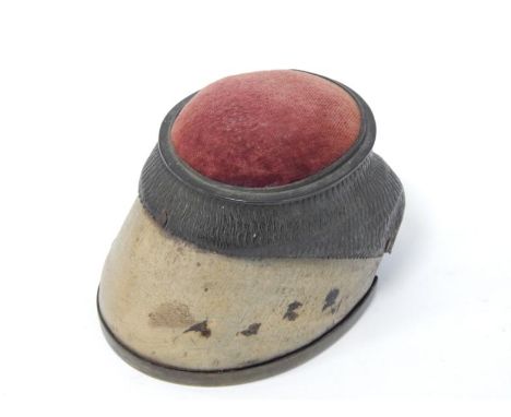 A Victorian horse's hoof pin cushion