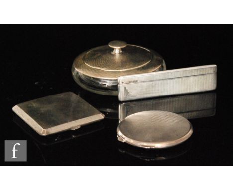 Two hallmarked silver compacts, one circular, the other square with a clear cut glass and silver powder jar and a silver case