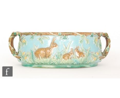 A late 19th Century George Jones majolica game pie tureen base, decorated with images of rabbits in woodland to a light blue 