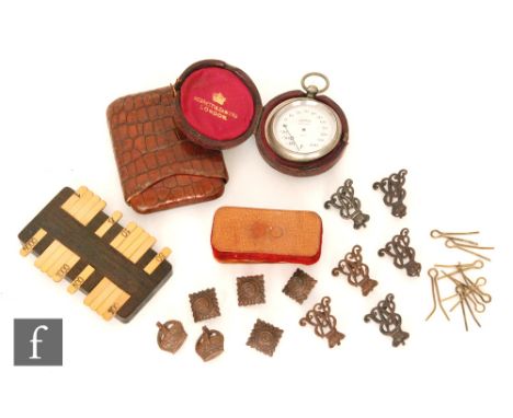 An early 20th Century small pocket crocodile skin cigar case stamped Churchill, a Thernidex pocket barometer in a Negretti an
