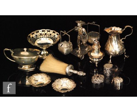 A Chinese silver condiment set modelled as standing man with a shoulder pole, a Georgian cream jug, a mustard pot three small