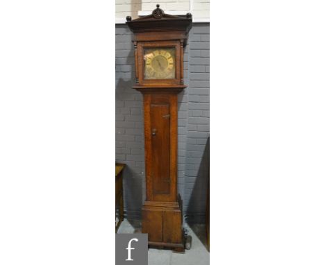 An early 19th Century and later converted oak longcase clock with thirty hour movement, the brass dial signed W Winn Hinstock