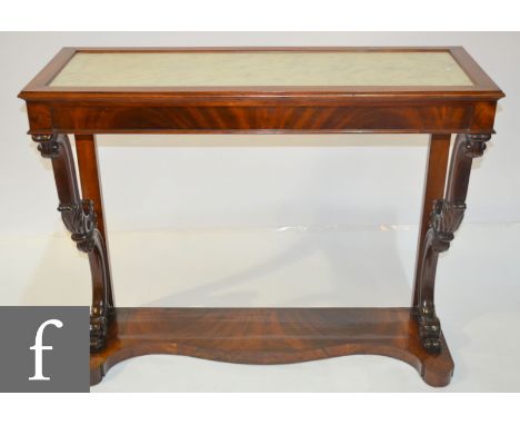 A 19th Century mahogany console table with white marble inset rectangular top on twin scroll supports united from a serpentin