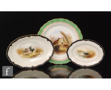 A Royal Worcester cabinet plate decorated to the central well with two woodcock birds by S. Johnson within a green border edg