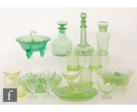 A collection of assorted uranium green glass tableware, to include a decanter of compressed globe and shaft form, the neck fa