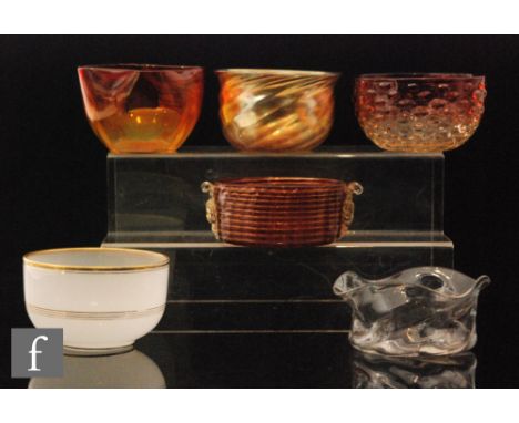 A set of four 19th Century finger bowls of circular section with triform wave rim, straw coloured opalescence above frosted b