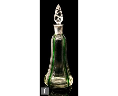 An early 20th Century Stevens and Williams clear crystal decanter of bell form with applied green trails, below a hallmarked 