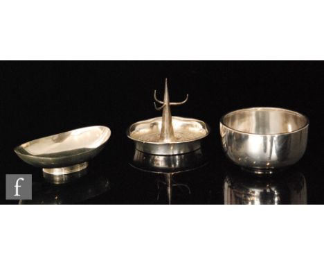 A hallmarked silver ring tree with foliate embossed shaped circular base, a small plain oval pedestal dish and a circular sug