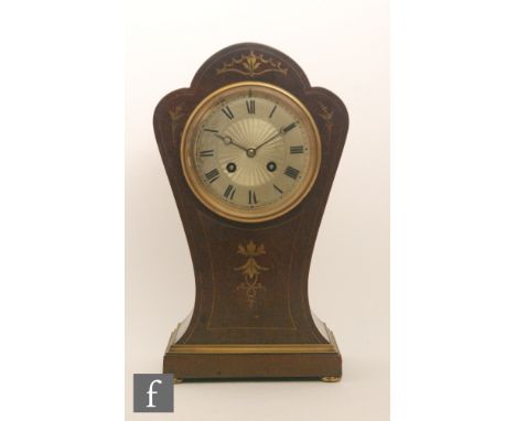 An Edwardian brass inlaid mahogany balloon shaped mantle clock with eight day French striking movement and radiating silvered